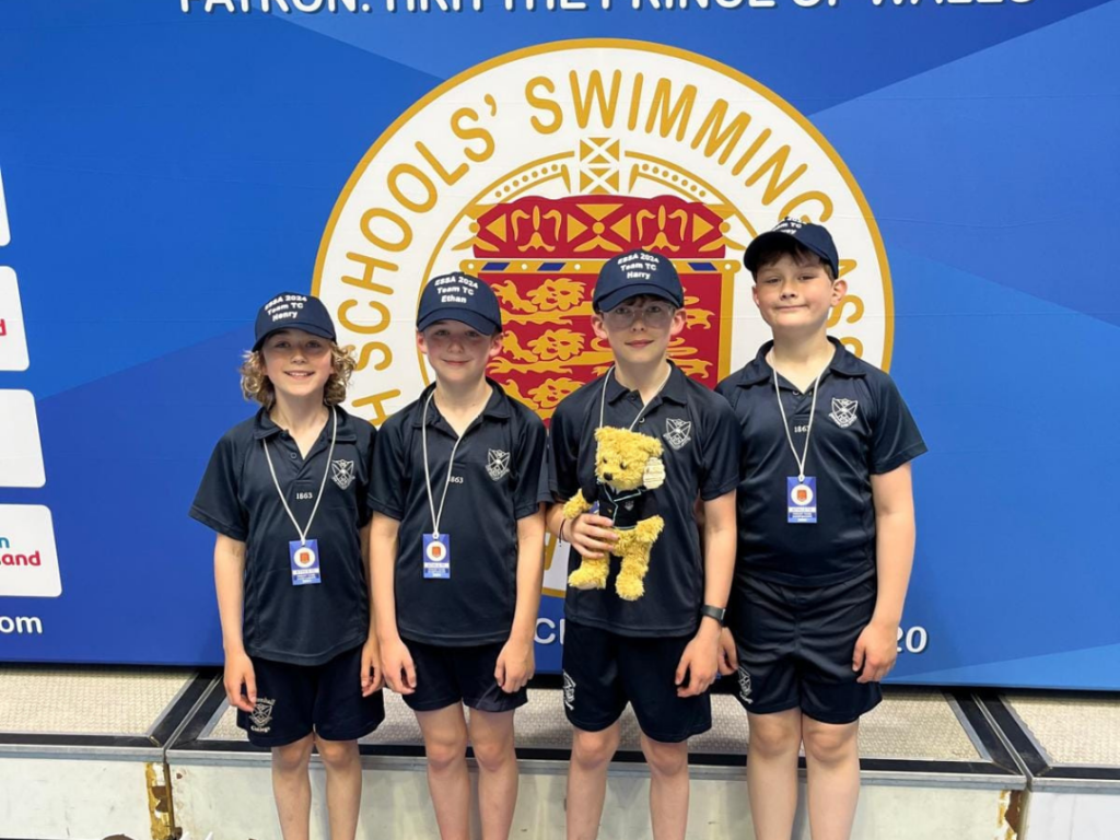 four boys with medals